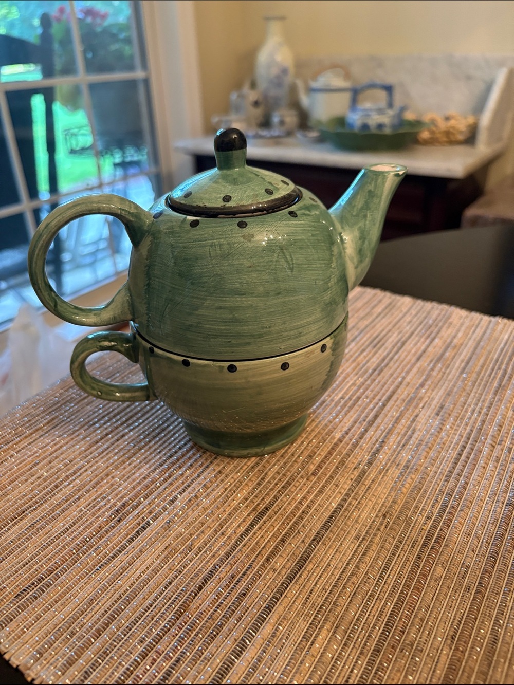 Design Pac teapot and cup set features a stackable, hand-painted green design .